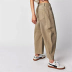 Beige Women's High-Waisted Barrel Leg Jeans — Dot Denim Curved-Seam Relaxed - Side Pose Sneakers