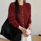 Red Women's Rainbow Button Knit Cardigan — Allie Ribbed-Knit Crew Neck Relaxed - Front Half Body Holding Coffee