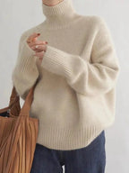 Beige Women's Cashmere Turtleneck Sweater with Ribbed Cuffs & Relaxed Fit - Close Up Hand Detail