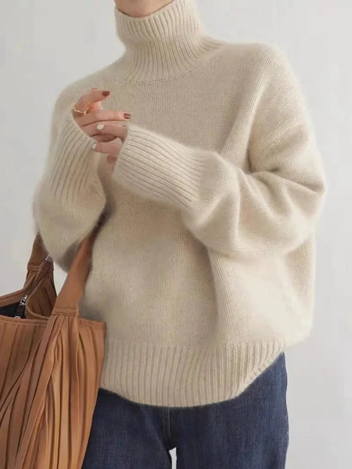 Beige Women's Cashmere Turtleneck Sweater with Ribbed Cuffs & Relaxed Fit - Close Up Hand Detail