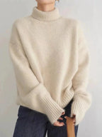 Women's Cashmere Turtleneck Sweater with Ribbed Cuffs & Relaxed Fit - Front Crossed Arms