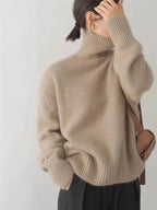 Khaki Women's Cashmere Turtleneck Sweater with Ribbed Cuffs & Relaxed Fit - Back Hair Pose