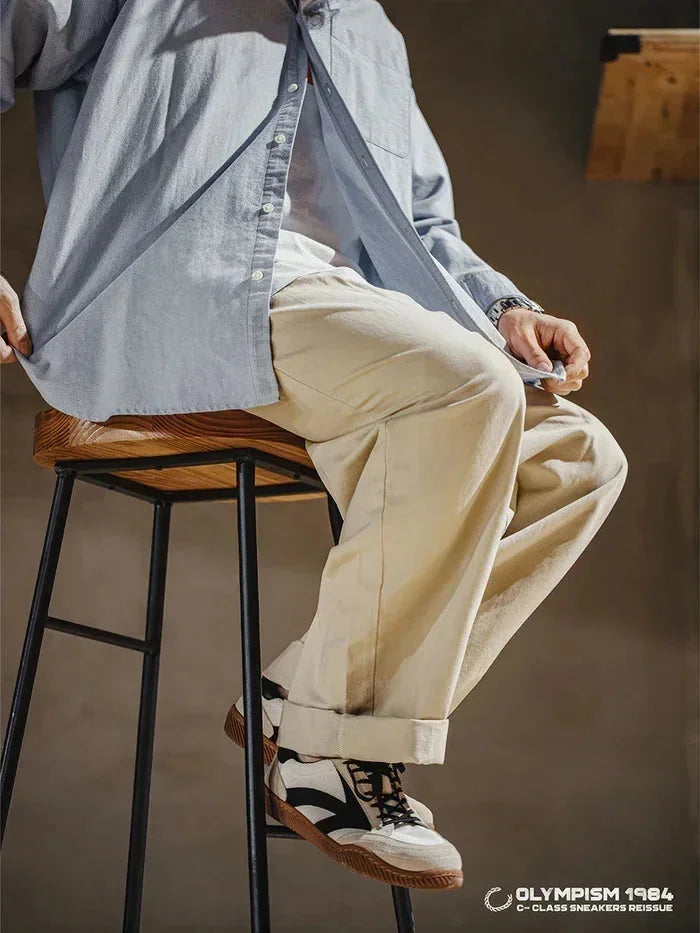 Beige Men's Classic Retro Sneakers with Lace-Up Closure & Suede Panels — Beau - Seated Styling Pose