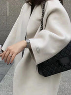Women's Long Wool Coat with Collarless Neckline & Relaxed Fit - Close Up Detail