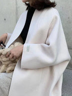 White Women's Long Wool Coat with Collarless Neckline & Relaxed Fit - Close Up Sleeve