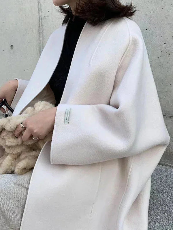 White Women's Long Wool Coat with Collarless Neckline & Relaxed Fit - Close Up Sleeve
