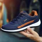 Men's Cushioned Lace-Up Sneakers with Padded Heel Support - Hand Held Side