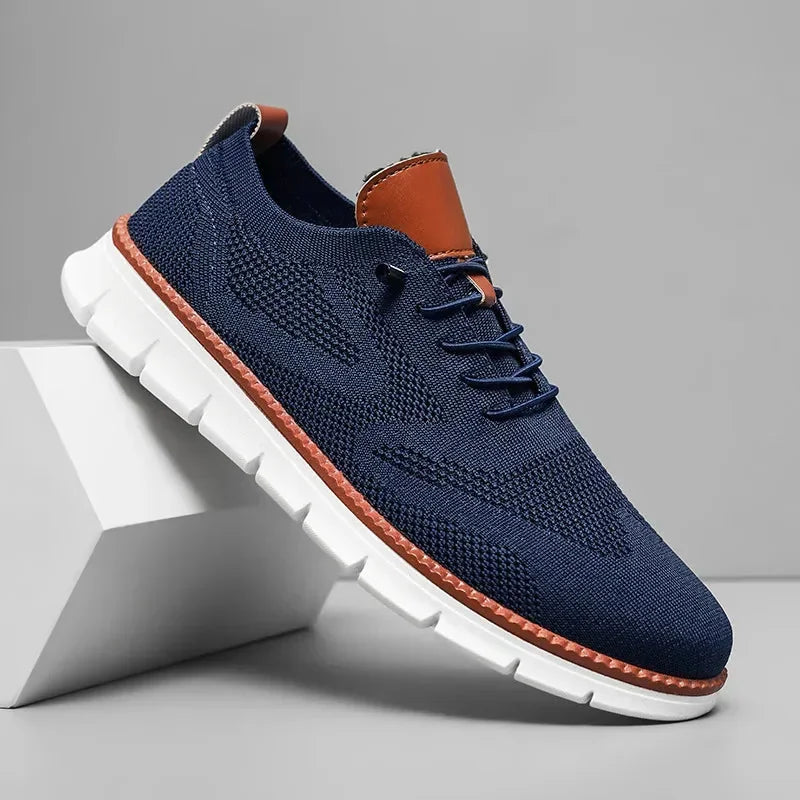Blue Men's Comfortable Shoes for Men — Edmund Cushioned Breathable Sneakers - Studio Angled Front Navy