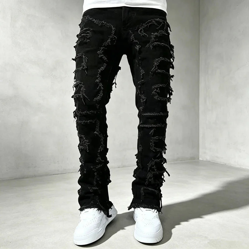 Black Men's Ripped Skinny Jeans with Stretch Denim & Stacked Fit - Front Closeup
