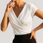 White Women's Draped Wrap Front Blouse with Cap Sleeves & V-Neck — Genevieve - Side Pose