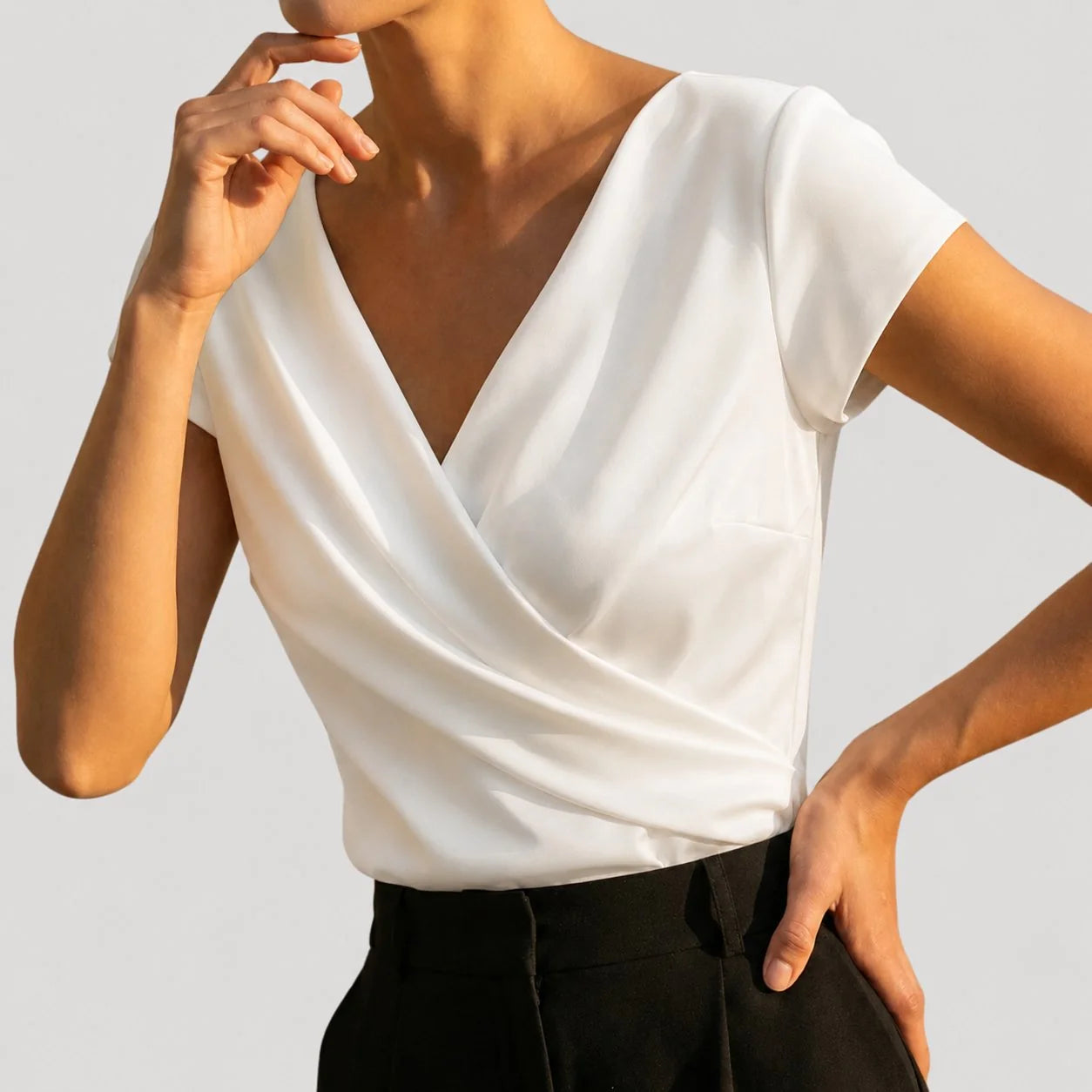 White Women's Draped Wrap Front Blouse with Cap Sleeves & V-Neck — Genevieve - Side Pose