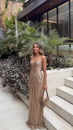 Gold Women's Glitter Maxi Dress with Corset Bodice & Ruched Skirt - Tropical Outdoor Pose