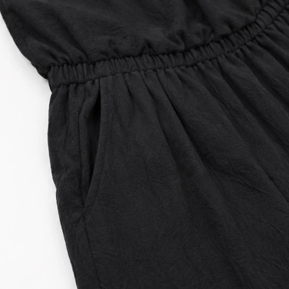 Black Women's Halter Neck Jumpsuit with Cowl Neckline & Wide-Leg Fit — Eva - Close Up Waist Pocket