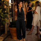 Black Women's Halter Neck Jumpsuit with Cowl Neckline & Wide-Leg Fit — Eva - Front Full Group Outdoor