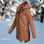 Orange Women's Rain Jacket With Hood — Lena Lightweight Waterproof Zip-Pocket - Side Pose Snow Trees