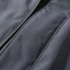 Gray Men's Hooded Waterproof Rain Jacket — Elle Nylon Zip-Pocket Adjustable Cuffs - Fabric Close Up