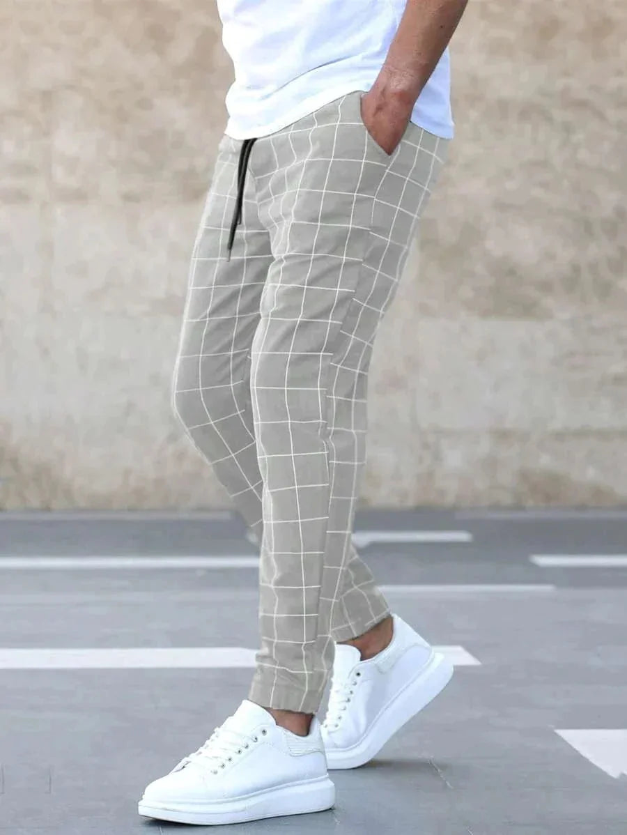 Men's Plaid Trousers with Drawstring Waist & Tapered Cuffed Fit - Walking Pose