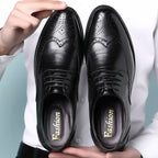 Black Men's Leather Oxford Shoes — Ronan Cushioned Wingtip Brogue - Hand Holding Pair