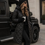 Black Women's Long Quilted Puffer Coat with Hood & Tailored Fit - Front Pose Car
