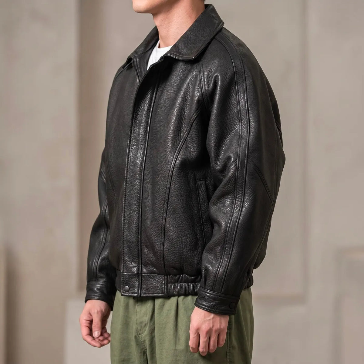 Black Men's Leather Jacket with Relaxed Fit & Soft Pebbled Texture - Side Pose
