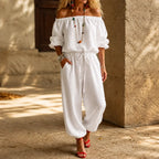 White Women's Off-Shoulder Wide-Leg Jumpsuit with Drawstring Waist & Elastic Cuffs — Tia - Front Full Corner