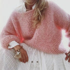 Light Pink Women's Oversized Knit Sweater with Relaxed Drop-Shoulder Fit — Coraline - Close Up Seated