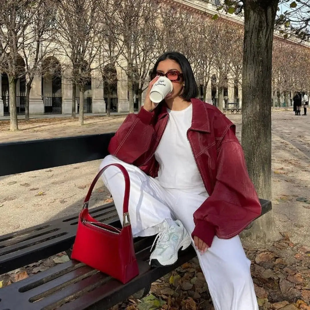 Burgundy Women's Oversized Quilted Bomber Jacket with Contrast Stitching & Relaxed Fit — Chloe - Bench Coffee Pose