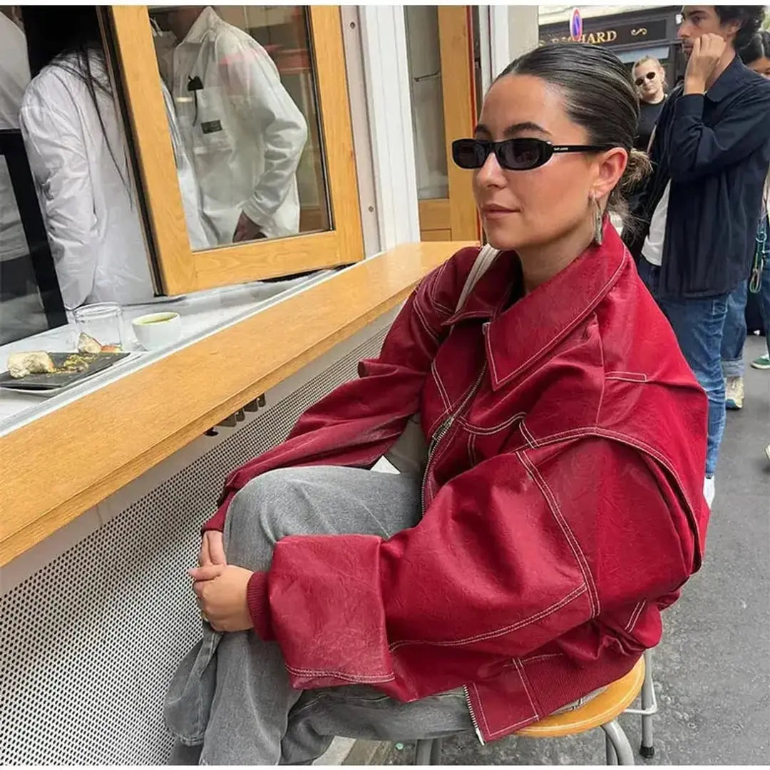 Burgundy Women's Oversized Quilted Bomber Jacket with Contrast Stitching & Relaxed Fit — Chloe - Cafe Seated Side
