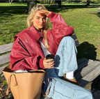 Red Women's Oversized Quilted Bomber Jacket with Contrast Stitching & Relaxed Fit — Chloe - Outdoor Park Bench