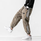 Men's Sherpa-Lined Jogger Pants with Striped Side Panels - Model Walking