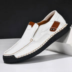 White Men's Casual Shoes with Arch Support — Meadow Slip-On Suede Loafers - Studio Background