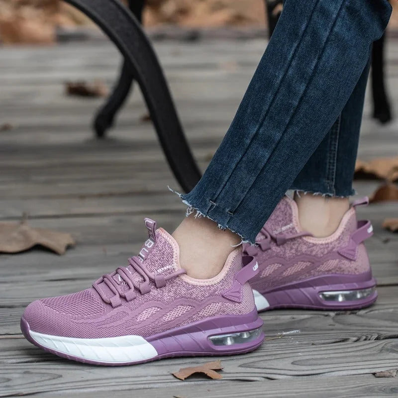 Purple Women's Steel Toe Sneakers with Air Cushion Sole & Lace-Up Closure - Outdoor Worn Pose