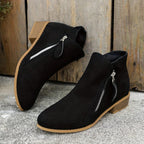 Black Women's Suede Ankle Boots — Tamsin Zip-Up Block Heel Pointed Toe - Pair Propped Display