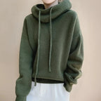 Green Women's Merino Wool Turtleneck Sweater with Drawstring Hood & Oversized Fit - Front Worn