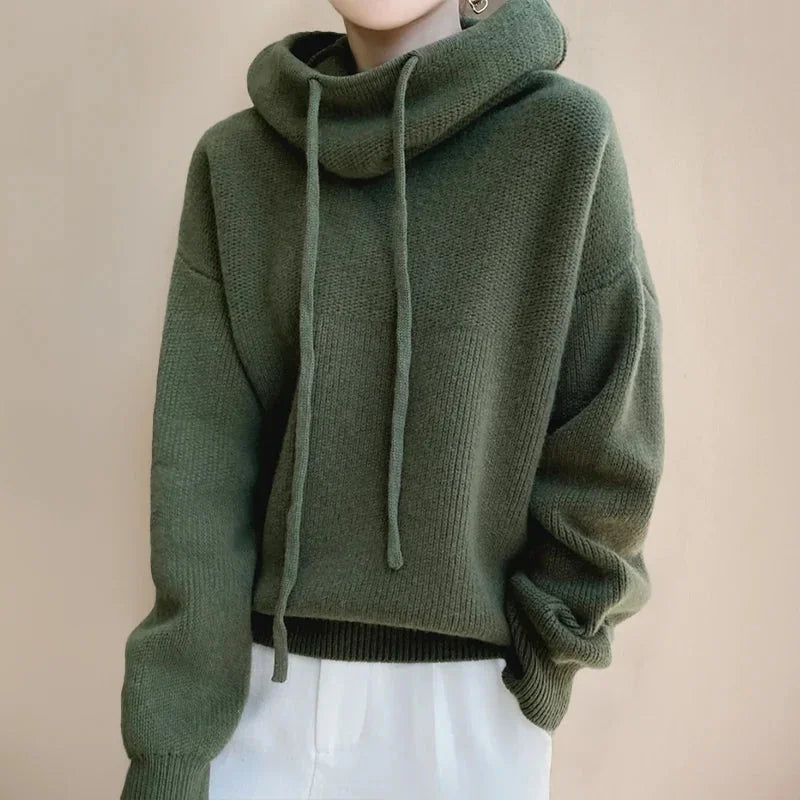 Green Women's Merino Wool Turtleneck Sweater with Drawstring Hood & Oversized Fit - Front Worn