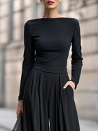 Black Women's Wide Leg Jumpsuit with Boat Neckline & Pleated High-Waist - Close Up Bodice