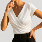 White Women's Wrap V-Neck Blouse with Draped Front & Cap Sleeves — Natalia - Side Pose